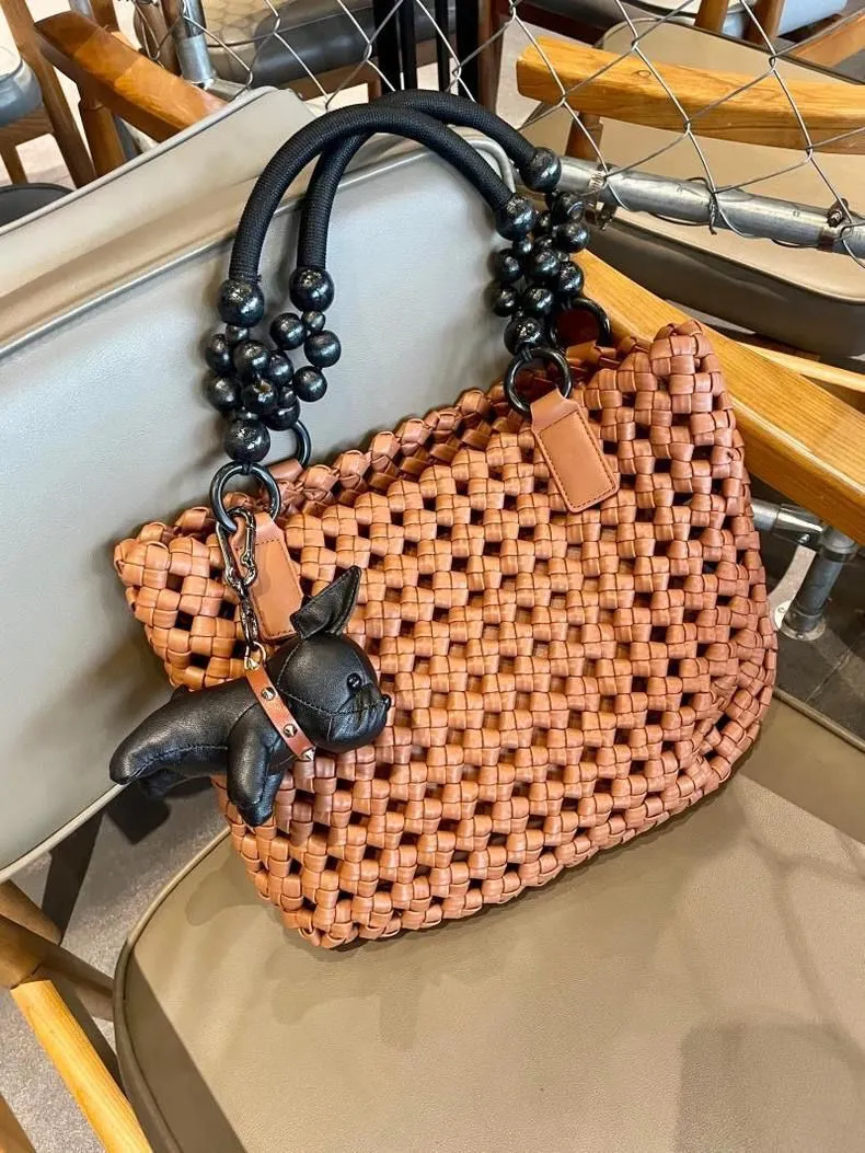 XIEYINSHE 2025 women's bags, large-capacity vegetable baskets, woven tote bags, portable high-grade hollow wooden beads, wrist and mother shoulder bags.