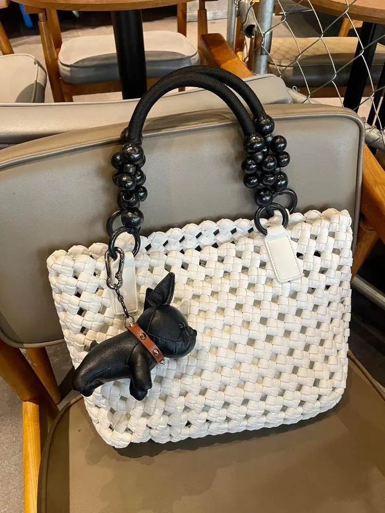 XIEYINSHE 2025 women's bags, large-capacity vegetable baskets, woven tote bags, portable high-grade hollow wooden beads, wrist and mother shoulder bags.